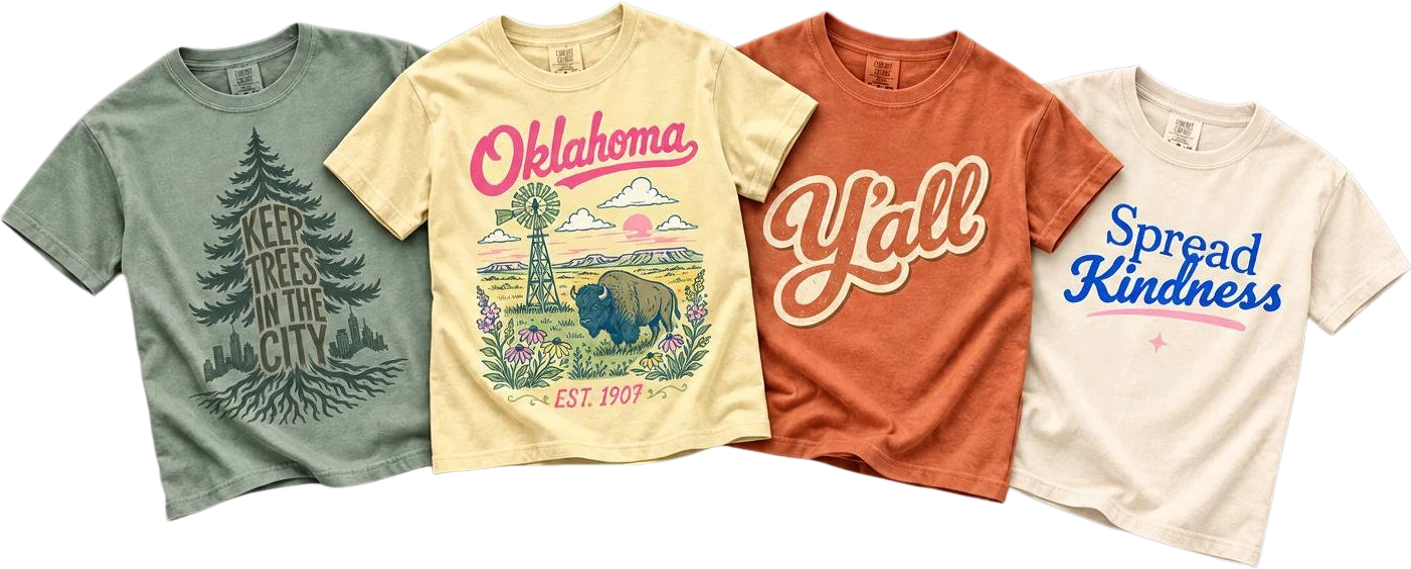 Four Kindling Threads tees laid out: Keep Trees in the City in sage, Oklahoma Est. 1907 in butter yellow, Y&rsquo;all in burnt orange, and Spread Kindness in ivory